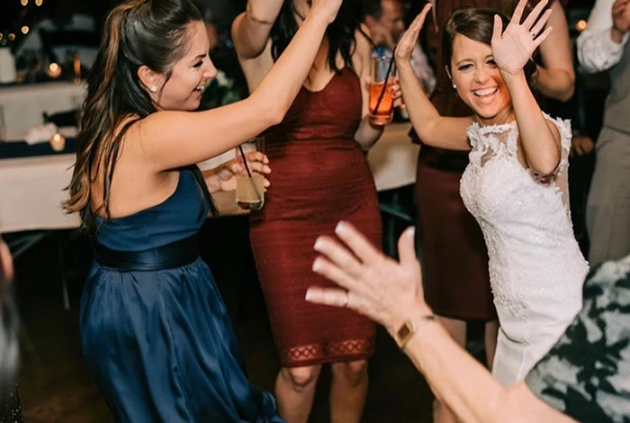 Bride dancing with guests at Adirondack Wedding