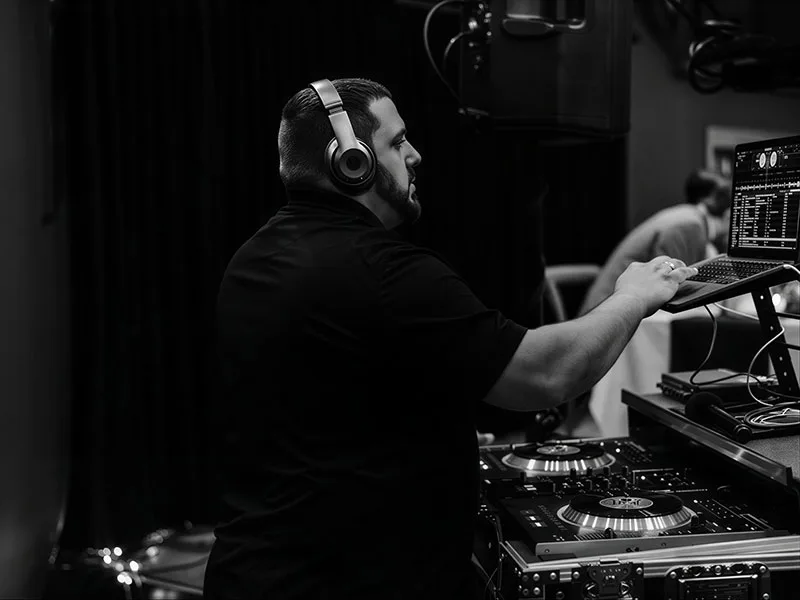 Max Nason, owner and head DJ of MX Productions, at the DJ controller